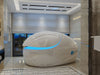 Dreampod Vmax Float Pod Isolation tank in a room with lights